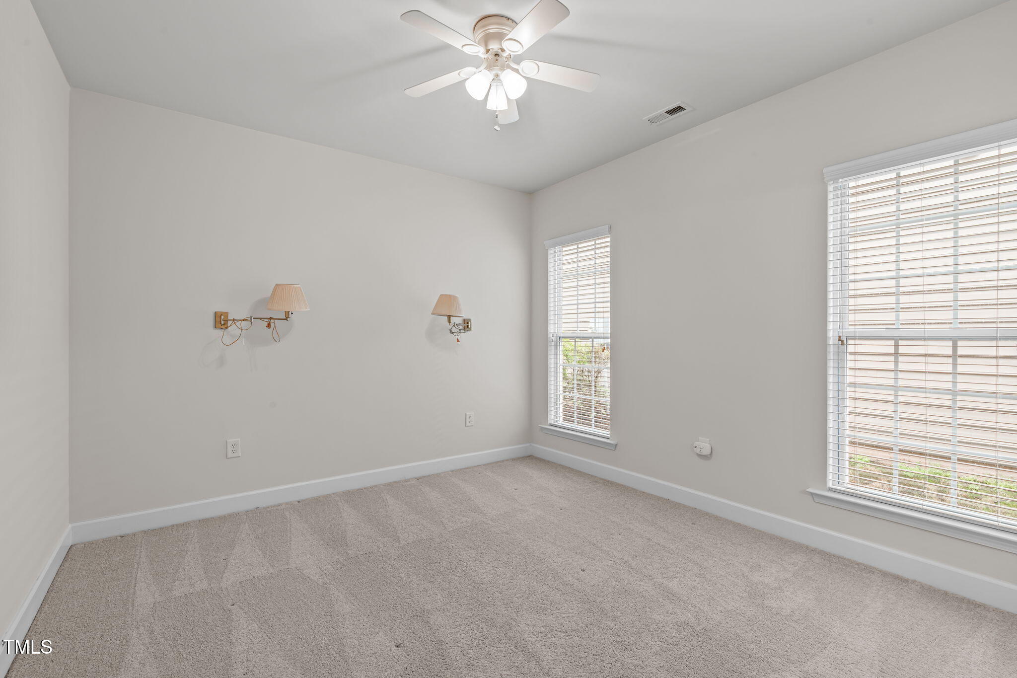 208 Beckingham Loop Cary, NC 27519 - Photo 33 of 47 a view of a livingroom with a ceiling fan and window