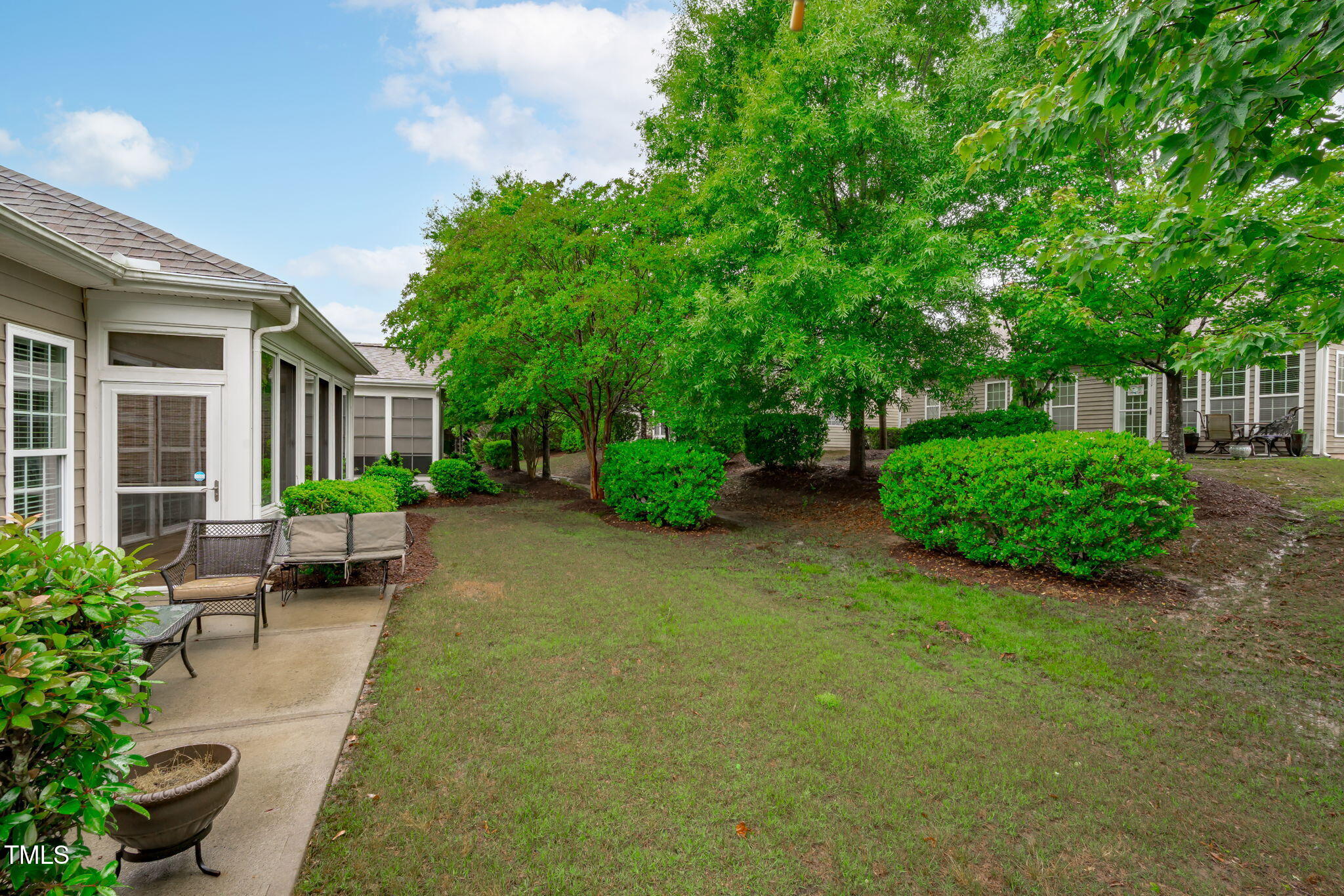 208 Beckingham Loop Cary, NC 27519 - Photo 41 of 47 a view of a backyard with sitting area