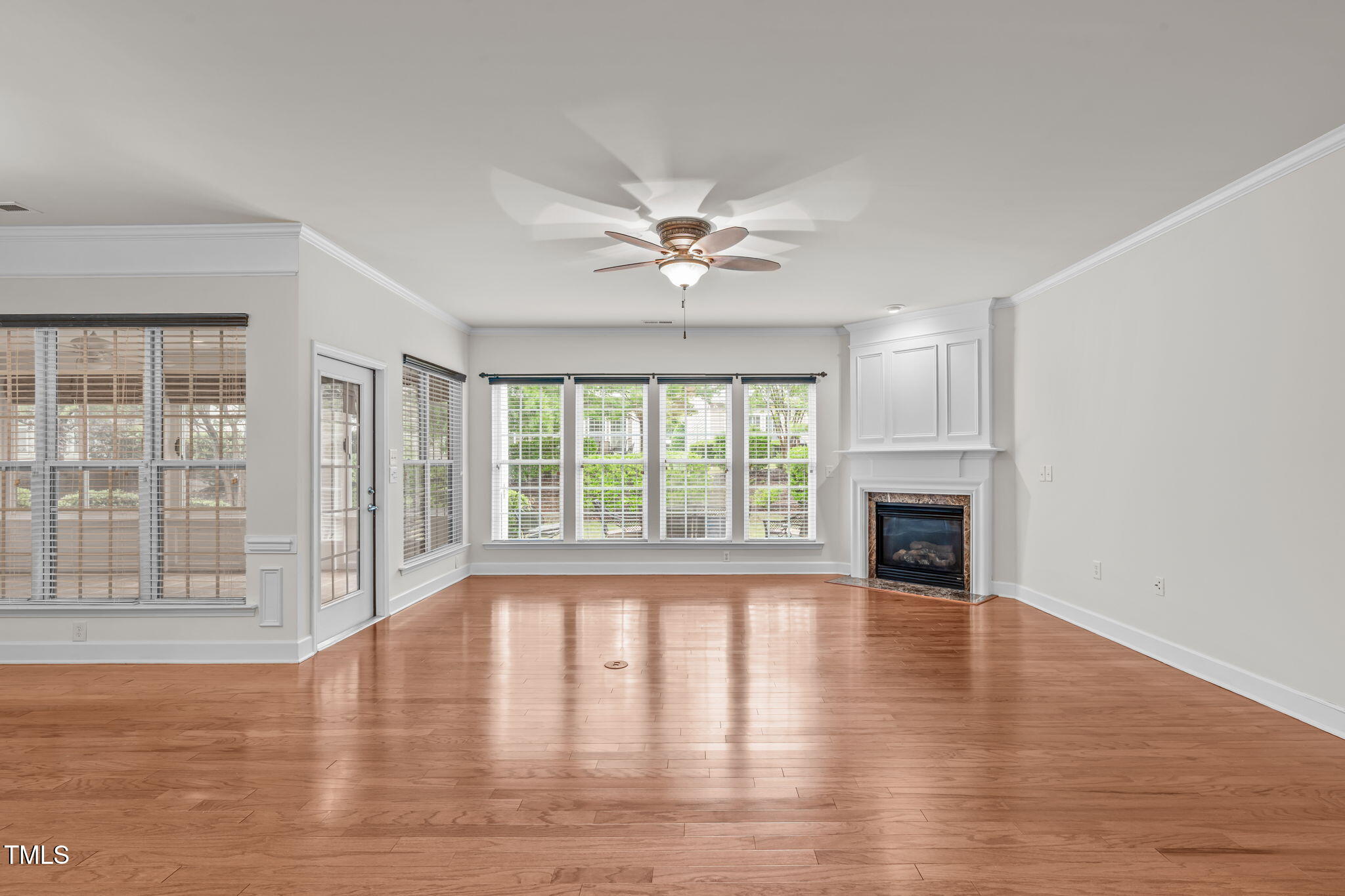 208 Beckingham Loop Cary, NC 27519 - Photo 5 of 47 a view of an empty room with wooden floor and a window