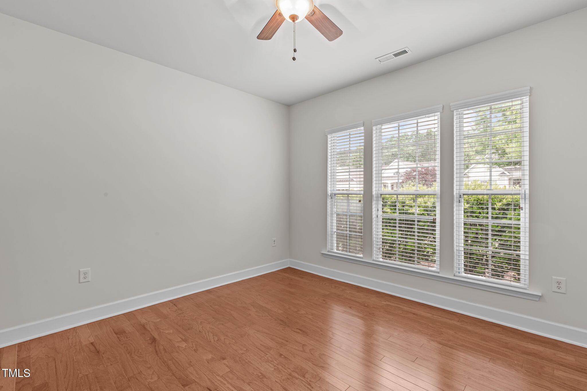 208 Beckingham Loop Cary, NC 27519 - Photo 6 of 47 a view of an empty room with a window
