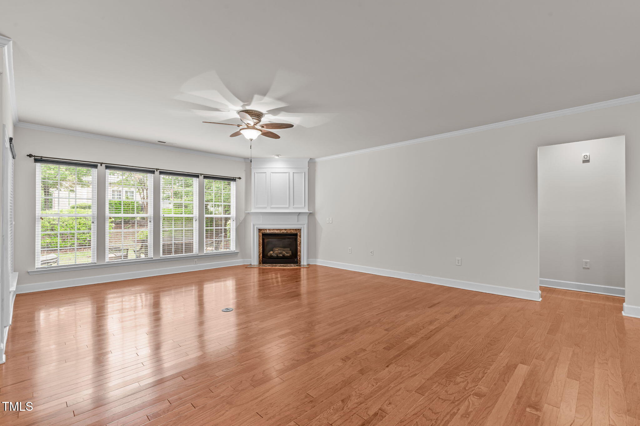208 Beckingham Loop Cary, NC 27519 - Photo 9 of 47 wooden floor in an empty room with a window