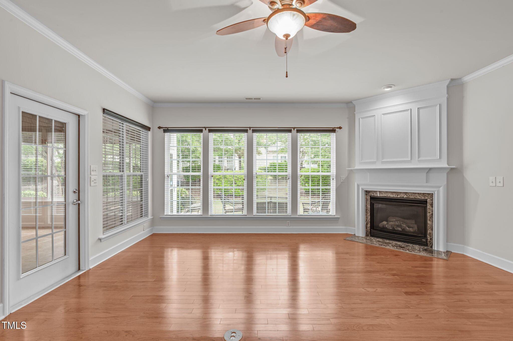 208 Beckingham Loop Cary, NC 27519 - Photo 10 of 47 a view of empty room with wooden floor and fireplace