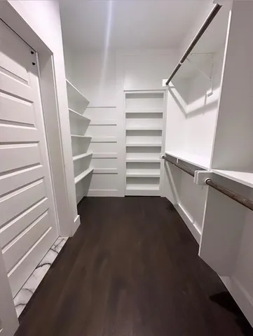 a view of an empty walk in closet