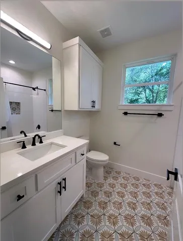 a bathroom with a bathtub and shower