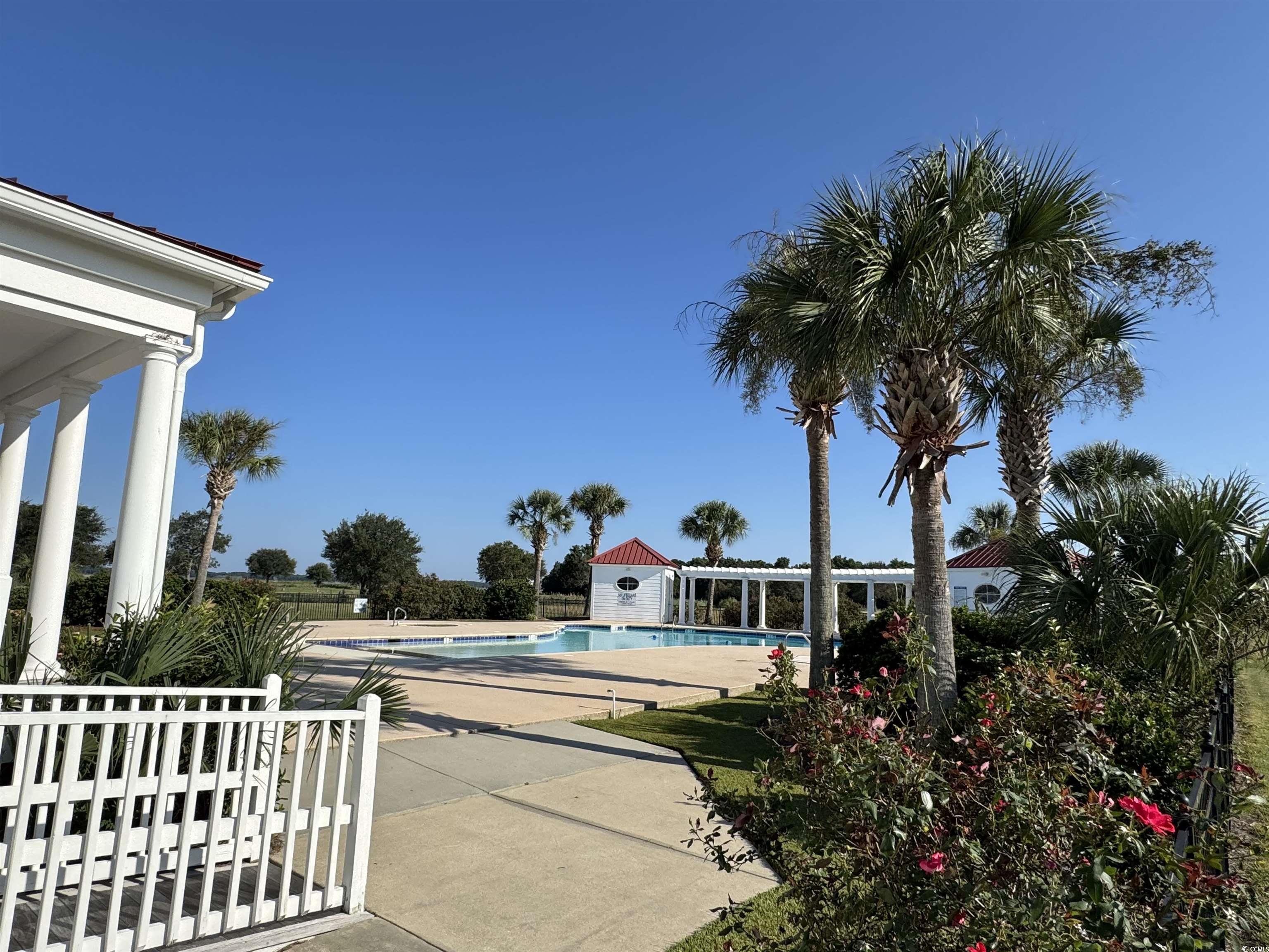Lot 95 Cravens Street Georgetown, SC 29440 - Photo 12 of 17 Community pool with a patio area