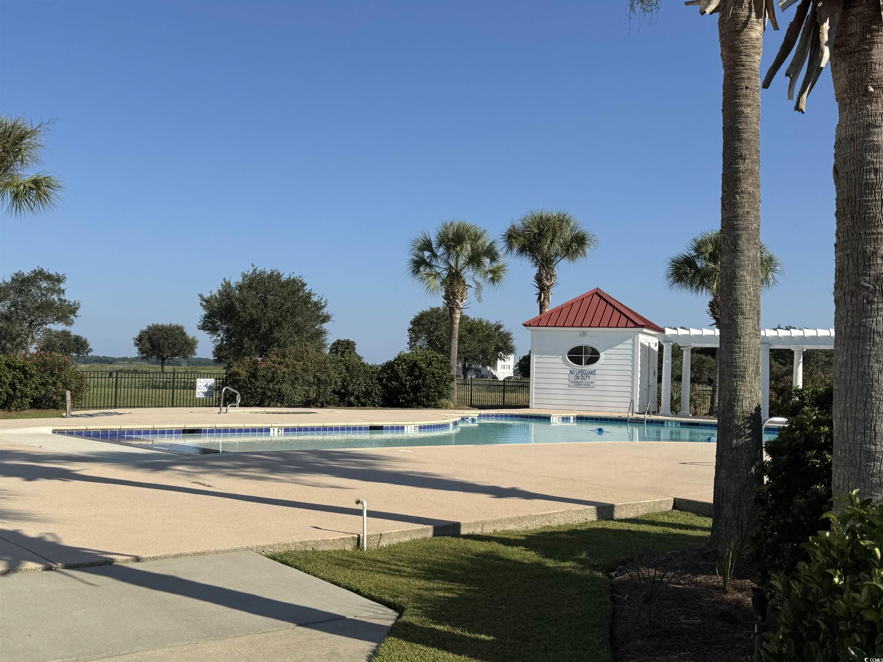 Lot 95 Cravens Street Georgetown, SC 29440 - Photo 13 of 17 Community pool with a patio area