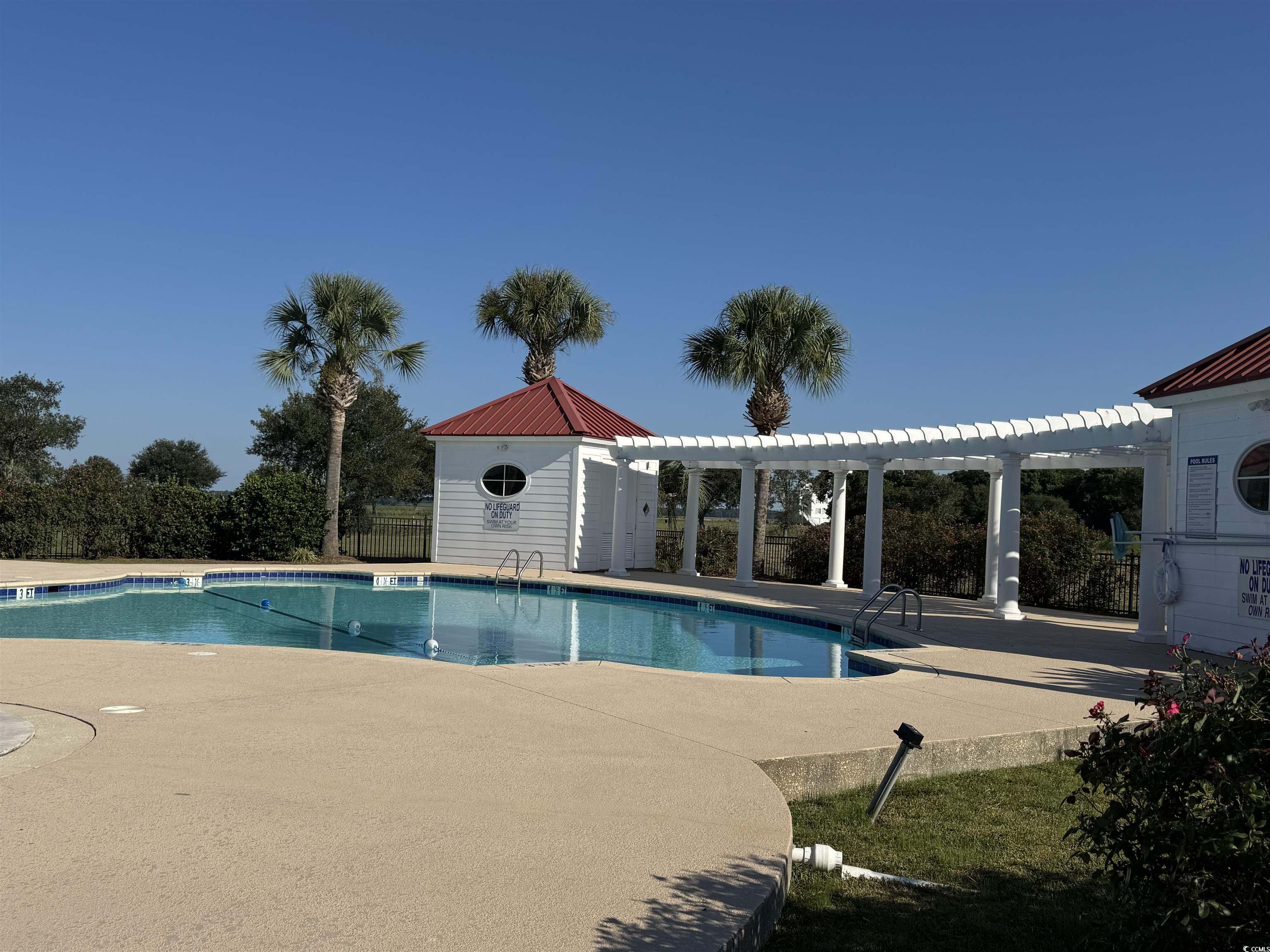 Lot 95 Cravens Street Georgetown, SC 29440 - Photo 15 of 17 Community pool featuring a pergola and a patio