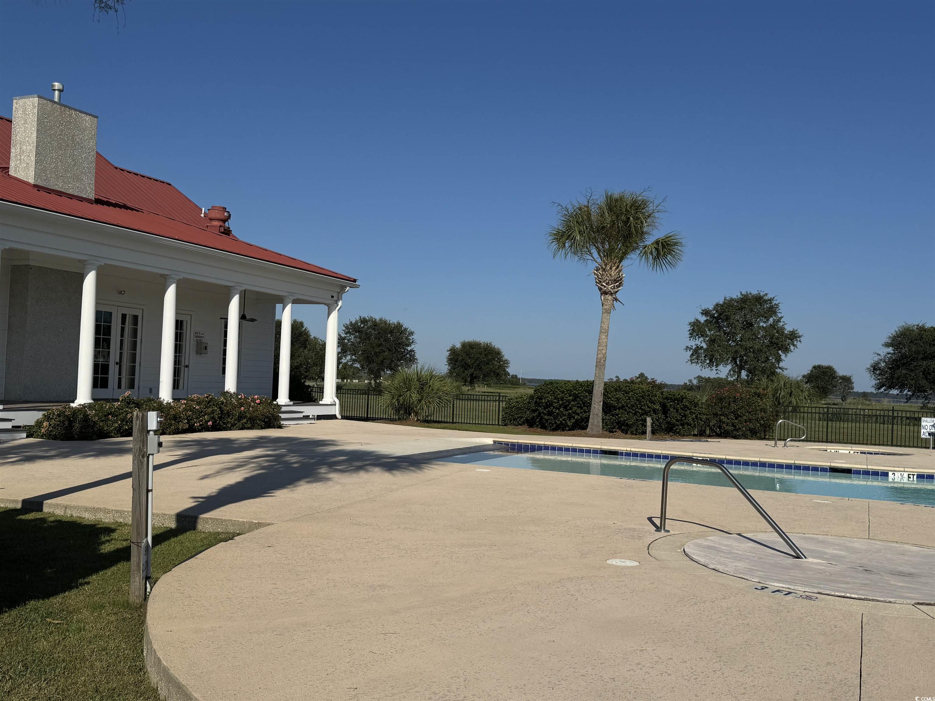 Lot 95 Cravens Street Georgetown, SC 29440 - Photo 17 of 17 Community pool featuring a porch