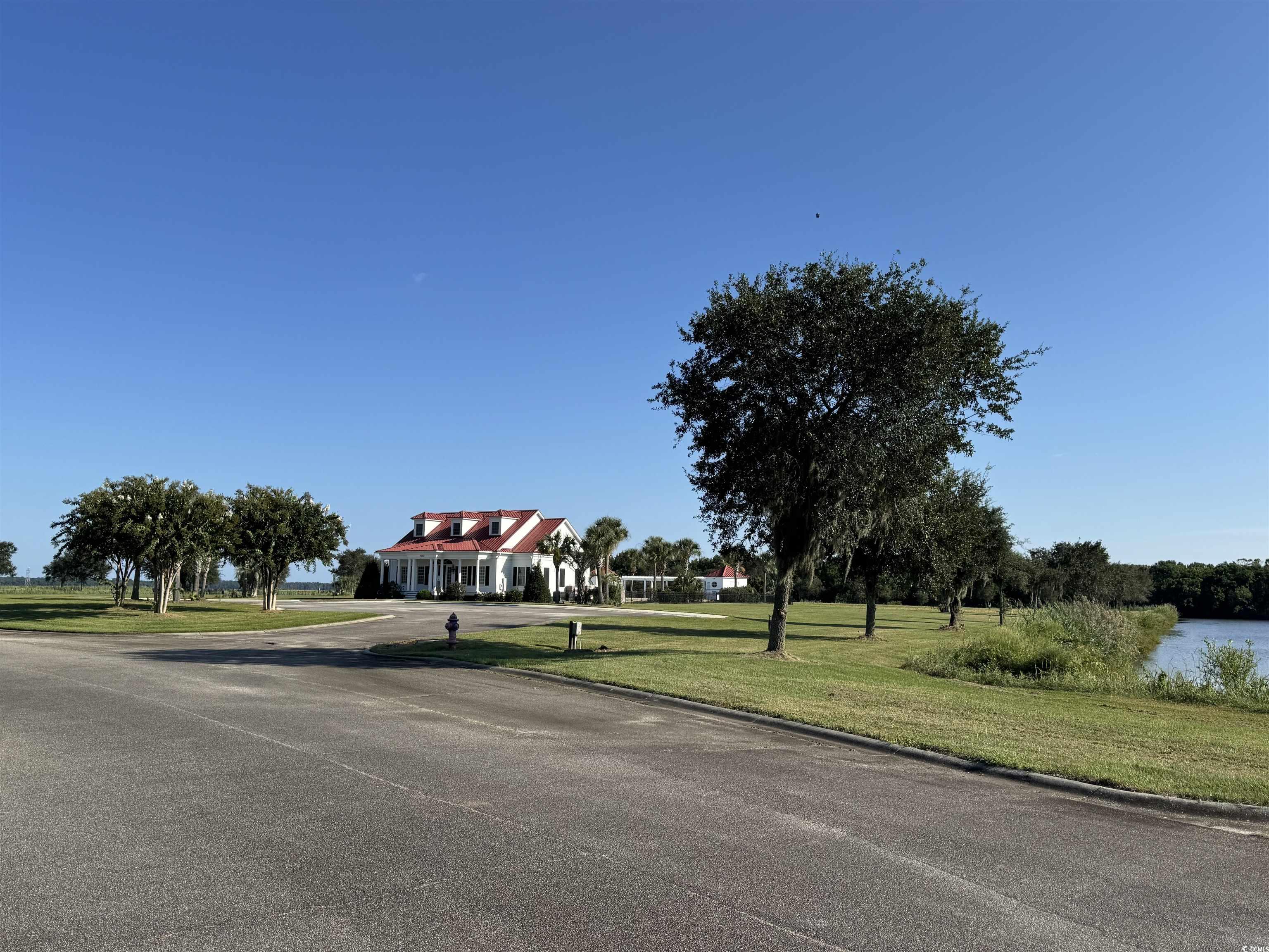 Lot 95 Cravens Street Georgetown, SC 29440 - Photo 4 of 17 View of asphalt street with a water view and curbs
