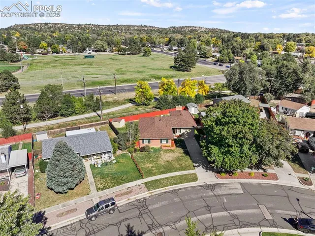 an aerial view of houses with yard