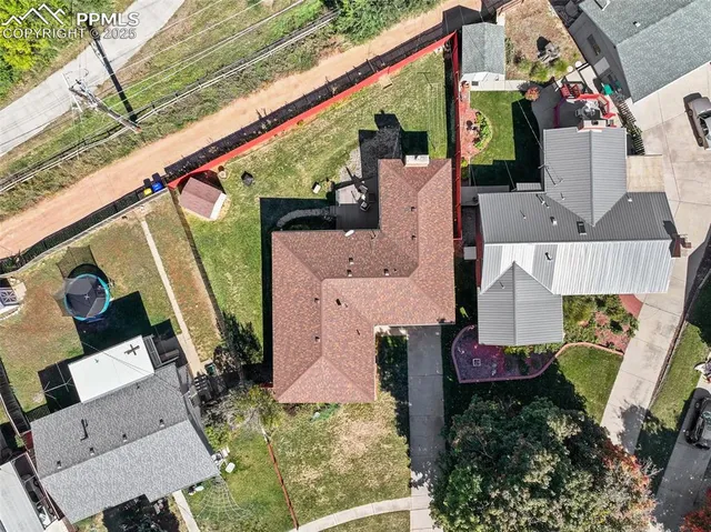an aerial view of house with a yard