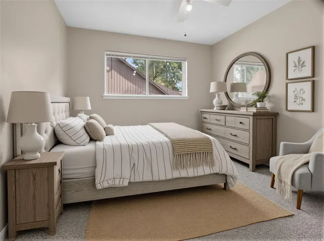 a bedroom with bed and window