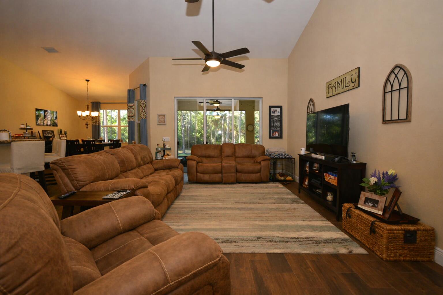11923 154th Road North Jupiter Farms, FL 33478 - Photo 2 of 6 a living room with furniture and a flat screen tv