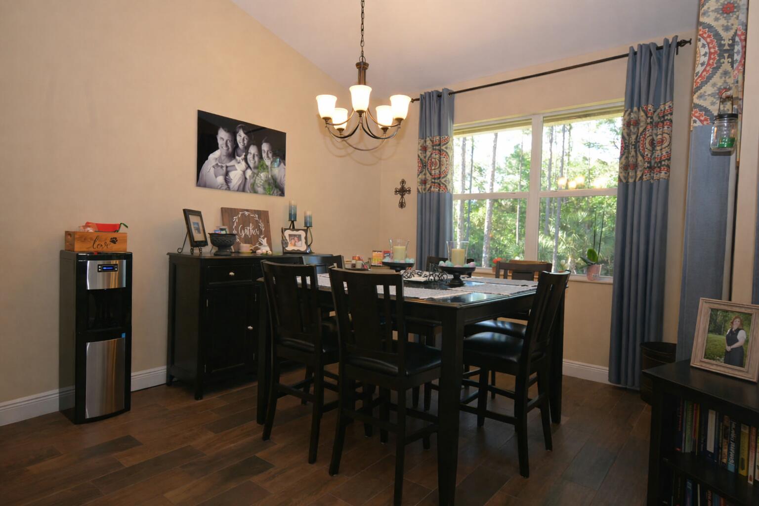 11923 154th Road North Jupiter Farms, FL 33478 - Photo 4 of 6 a view of a dining room with furniture window and wooden floor