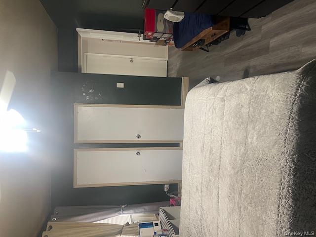 2165 Matthews Avenue, Unit 4F Bronx, NY 10462 - Photo 4 of 7 a bedroom with a bed and wooden floor