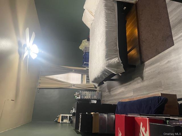 2165 Matthews Avenue, Unit 4F Bronx, NY 10462 - Photo 5 of 7 a bedroom with a bed and wooden floor