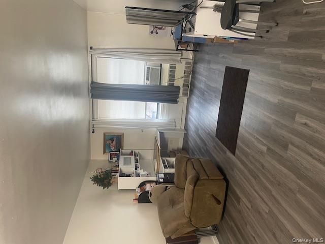 2165 Matthews Avenue, Unit 4F Bronx, NY 10462 - Photo 7 of 7 a living room with furniture and a wooden floor