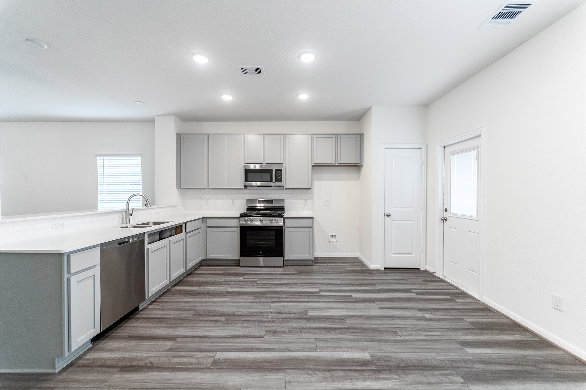 3527 Prairie Rose Trail Angleton, TX 77515 - Photo 2 of 19 a large kitchen with cabinets