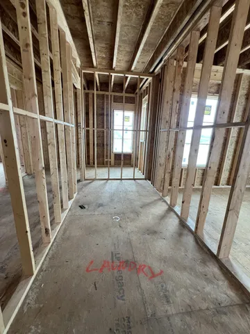 a view of an empty room with a fireplace