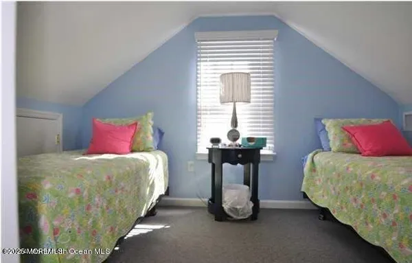 a bedroom with a bed and a table