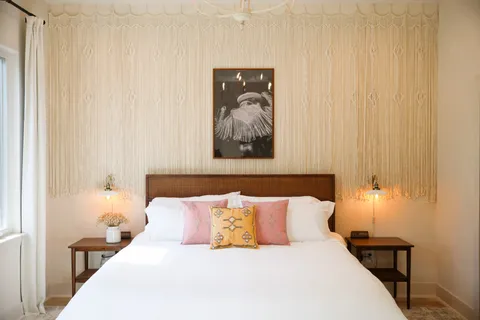 a bed room with a bed and a painting