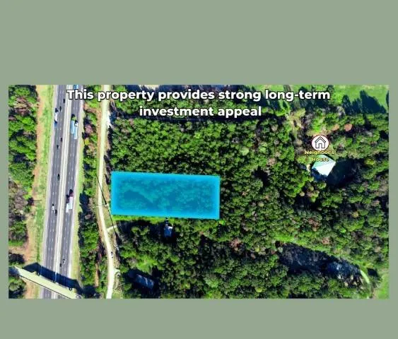 a view of swimming pool with an outdoor seating