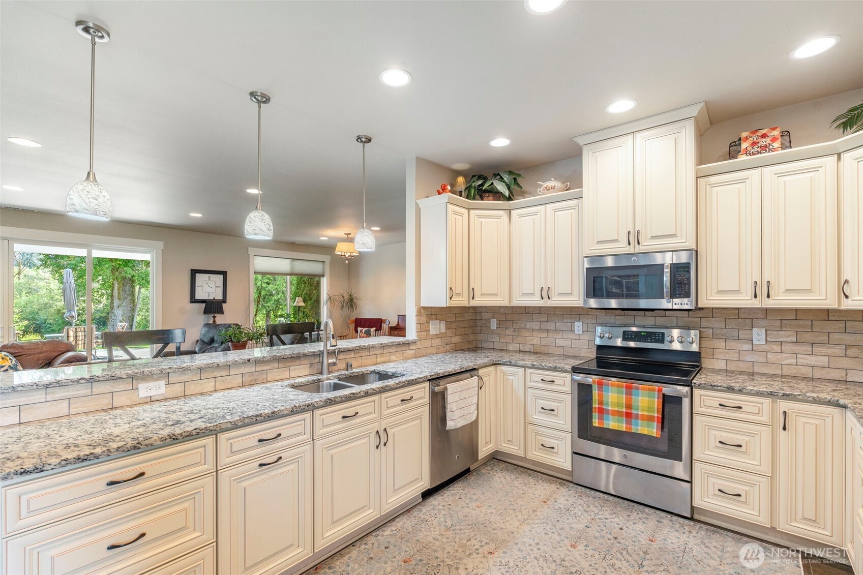 2322 Rice Road Chehalis, WA 98532 - Photo 17 of 39 a kitchen with stainless steel appliances granite countertop a stove sink and cabinets