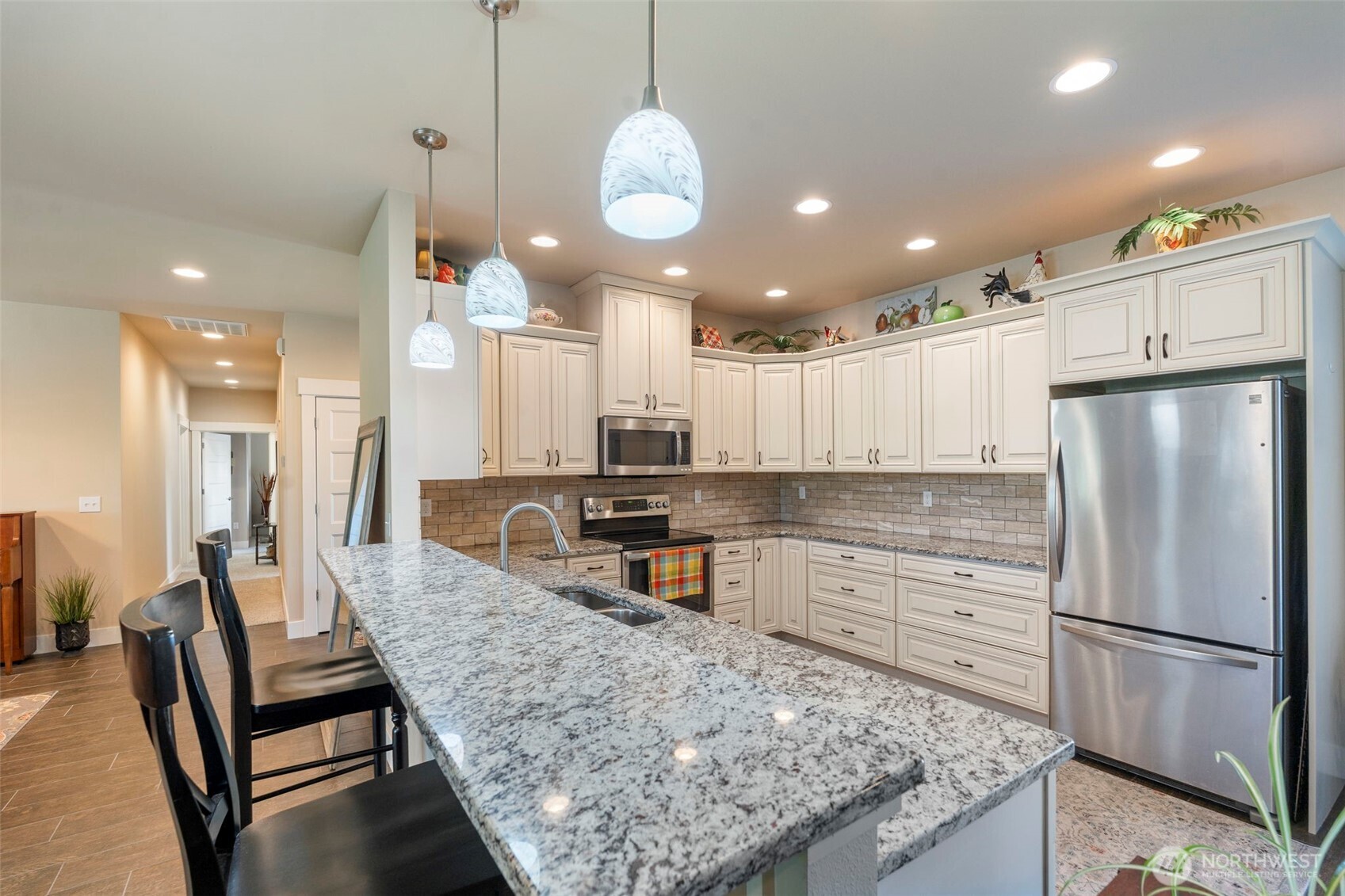 2322 Rice Road Chehalis, WA 98532 - Photo 19 of 39 a kitchen with stainless steel appliances granite countertop a sink refrigerator and cabinets