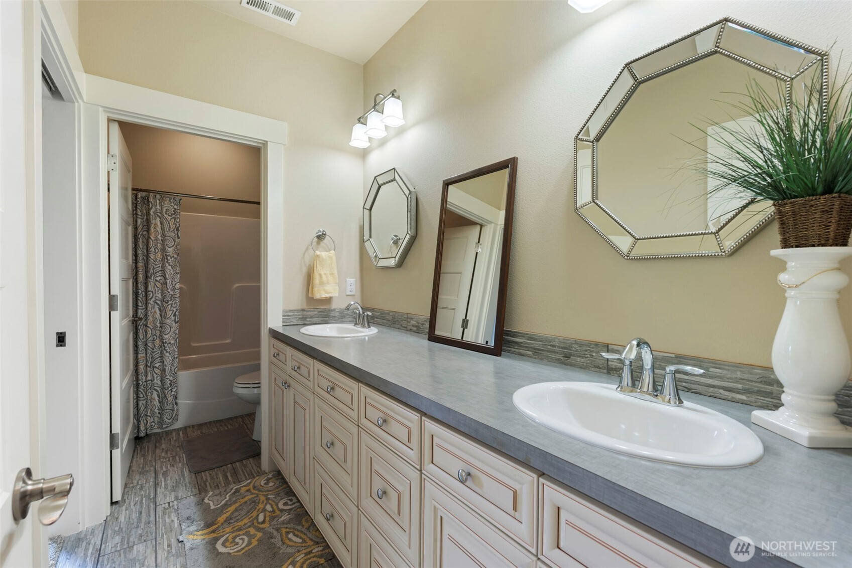 2322 Rice Road Chehalis, WA 98532 - Photo 23 of 39 a bathroom with a double vanity sink and a mirror