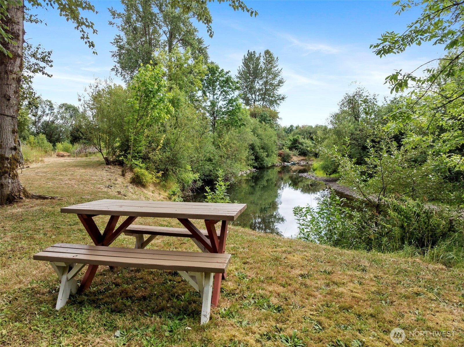 2322 Rice Road Chehalis, WA 98532 - Photo 4 of 39 a view of a wooden chairs and bench in the backyard