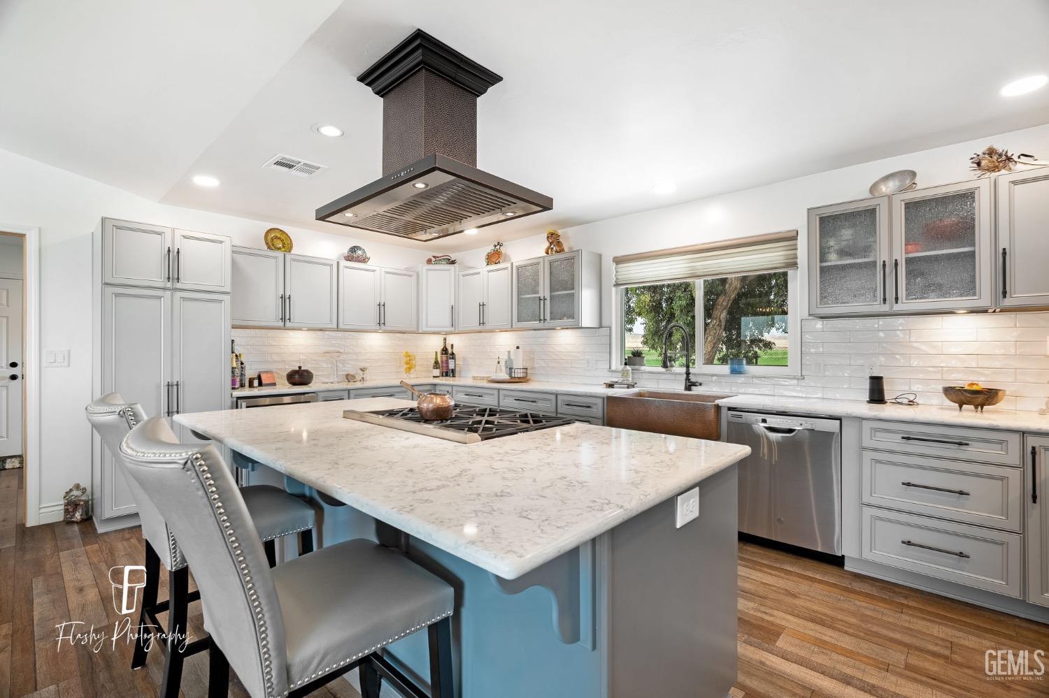 Undisclosed Address Buttonwillow, CA 93206 - Photo 12 of 65 a kitchen with a stove a table and chairs in it