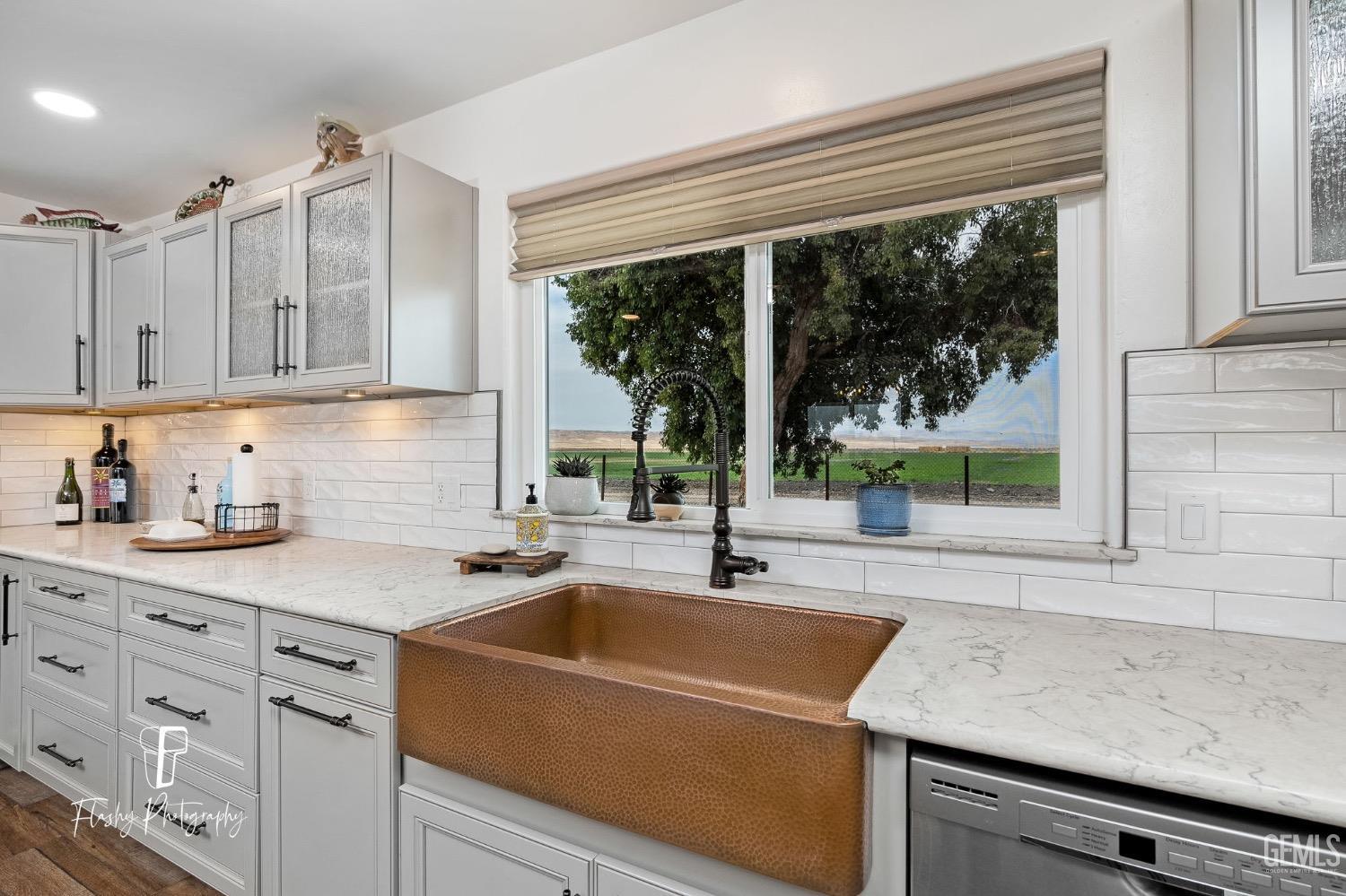 Undisclosed Address Buttonwillow, CA 93206 - Photo 13 of 65 a kitchen with granite countertop a sink and a window