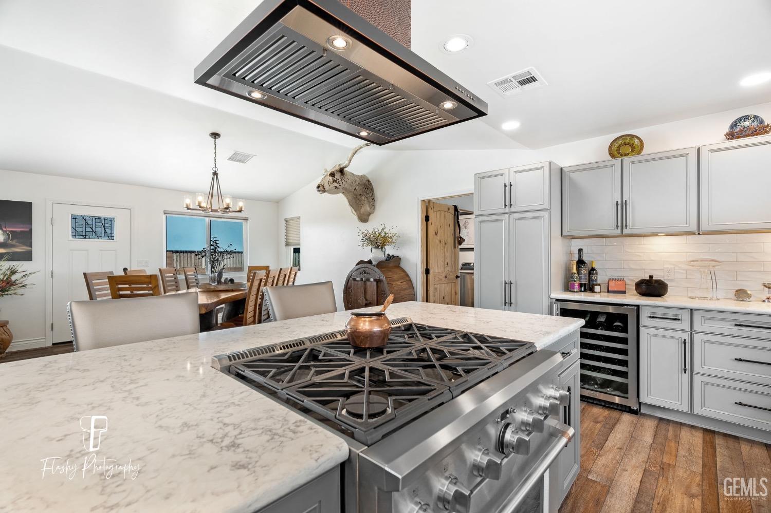 Undisclosed Address Buttonwillow, CA 93206 - Photo 15 of 65 a kitchen with a stove and a wooden floors