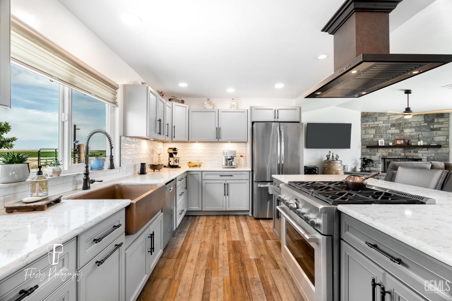 Undisclosed Address Buttonwillow, CA 93206 - Photo 16 of 65 a kitchen with stainless steel appliances granite countertop a sink stove and refrigerator