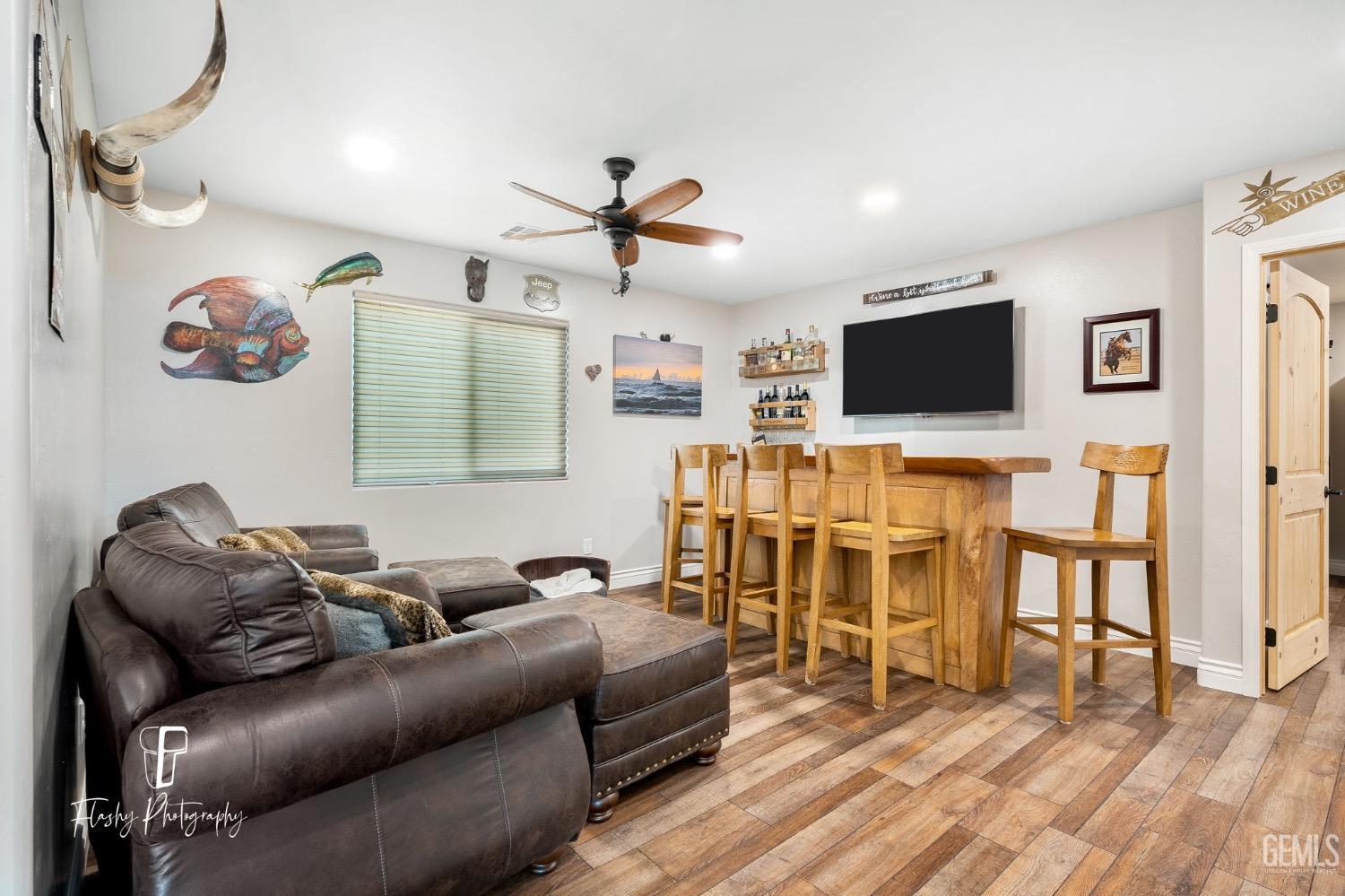 Undisclosed Address Buttonwillow, CA 93206 - Photo 19 of 65 a living room with furniture and a flat screen tv