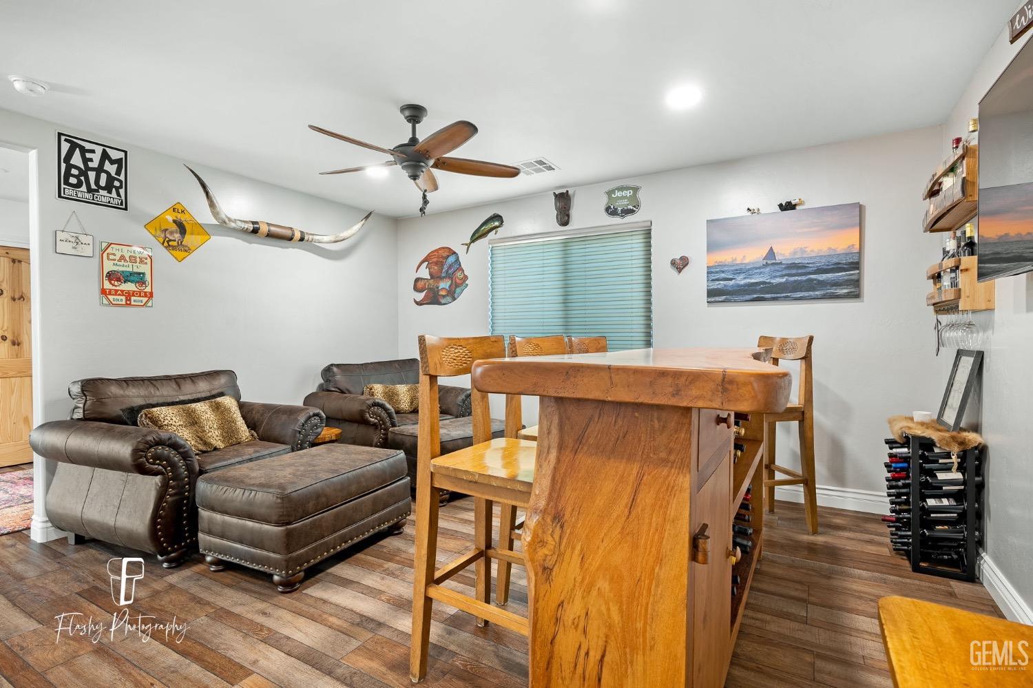Undisclosed Address Buttonwillow, CA 93206 - Photo 20 of 65 a living room with furniture and a flat screen tv