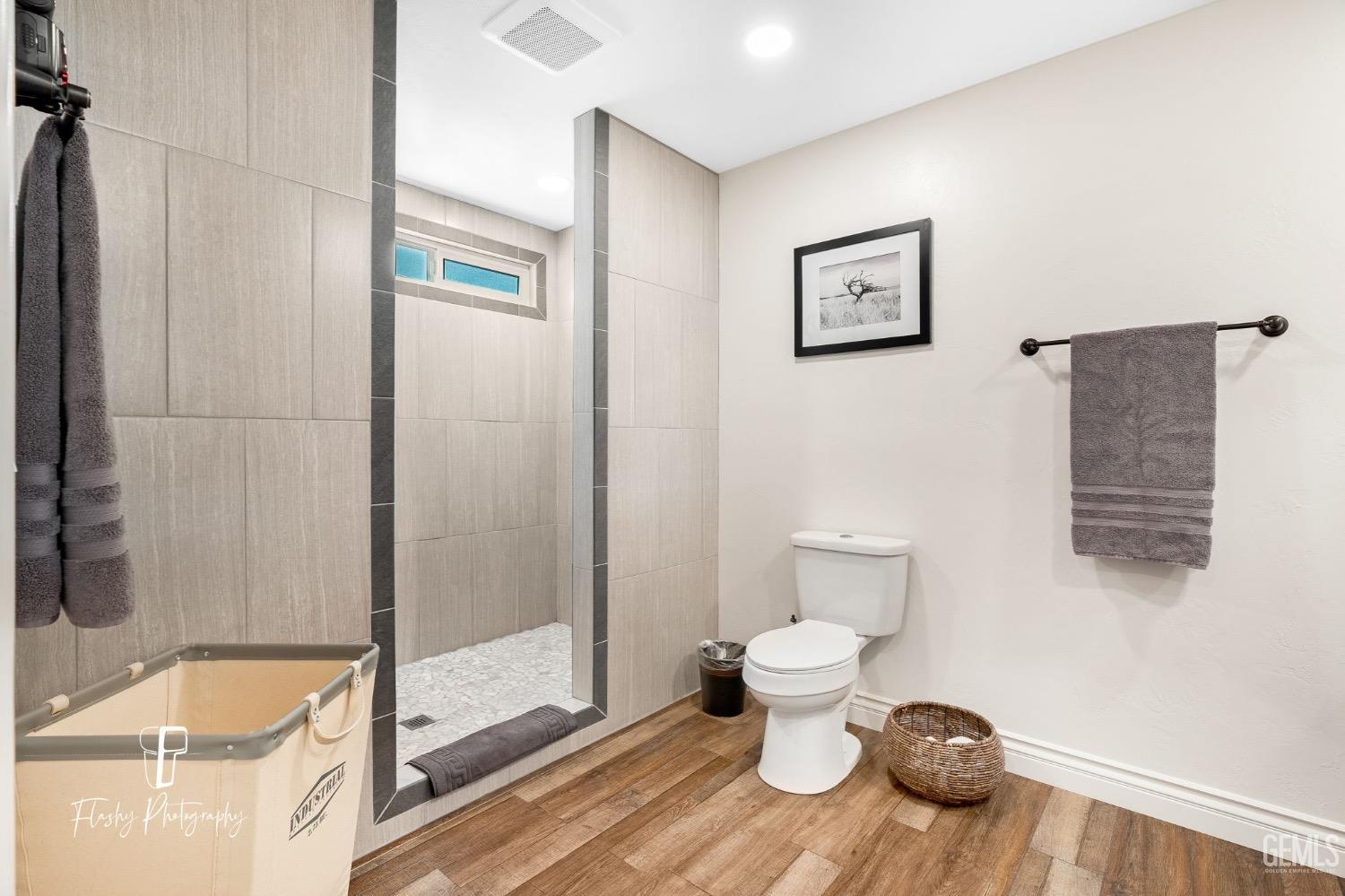 Undisclosed Address Buttonwillow, CA 93206 - Photo 25 of 65 a bathroom with a toilet and a shower