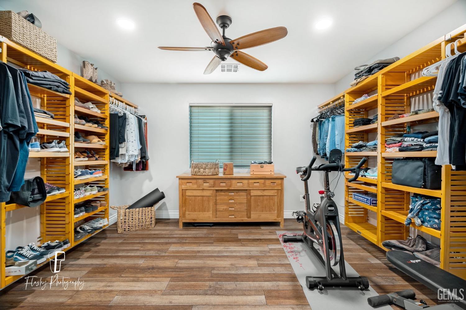 Undisclosed Address Buttonwillow, CA 93206 - Photo 29 of 65 a view of walk in closet with clothes and shoes