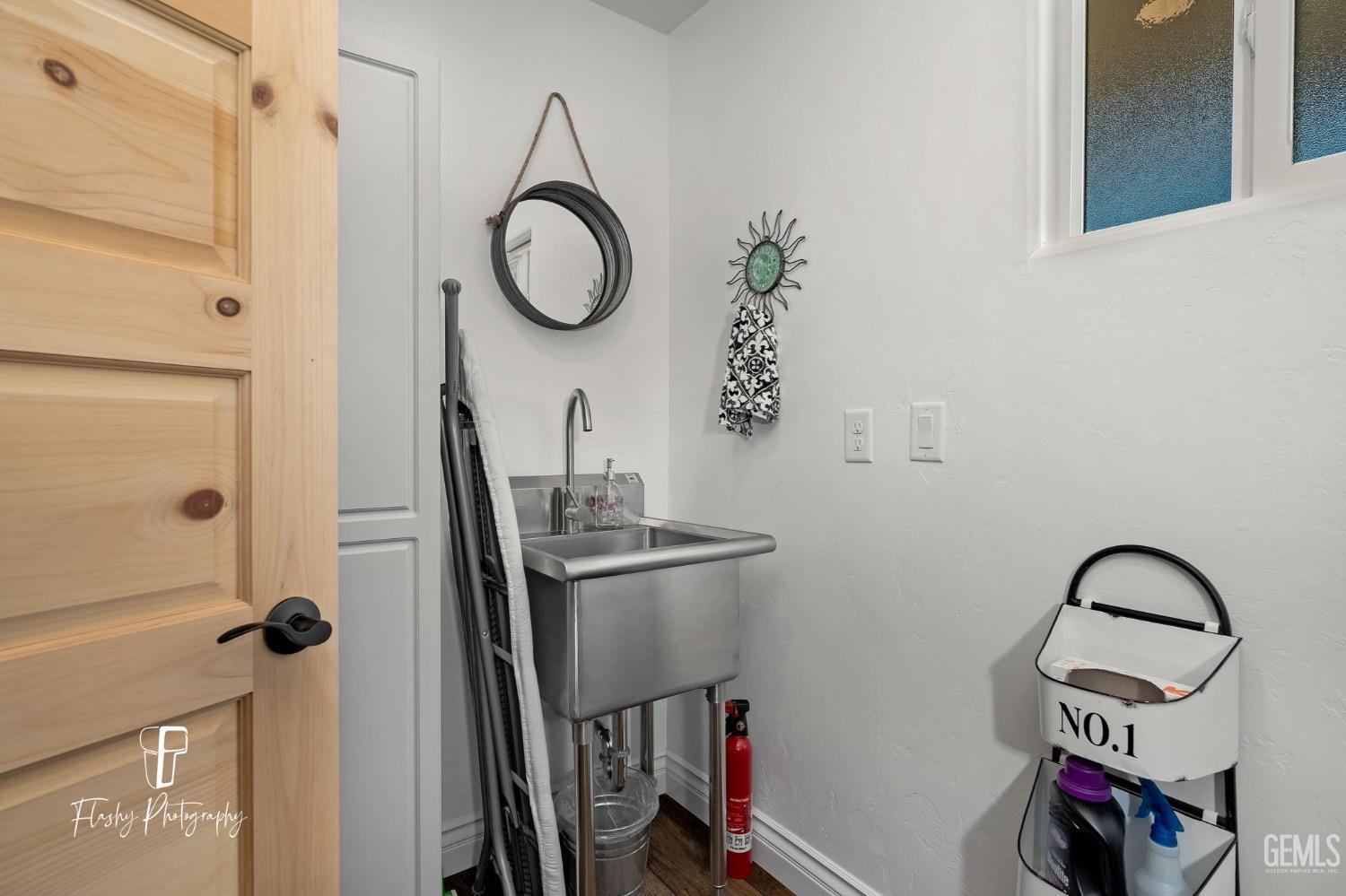 Undisclosed Address Buttonwillow, CA 93206 - Photo 34 of 65 a bathroom with a sink and a mirror