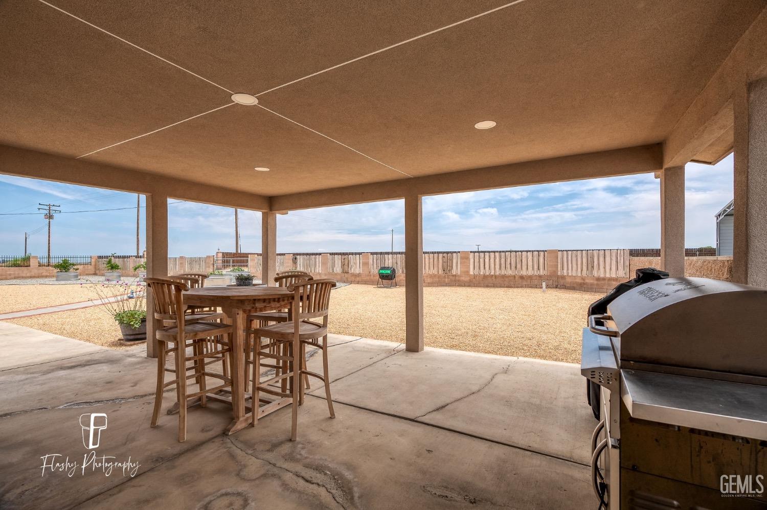 Undisclosed Address Buttonwillow, CA 93206 - Photo 35 of 65 a dining room with furniture and a floor to ceiling window