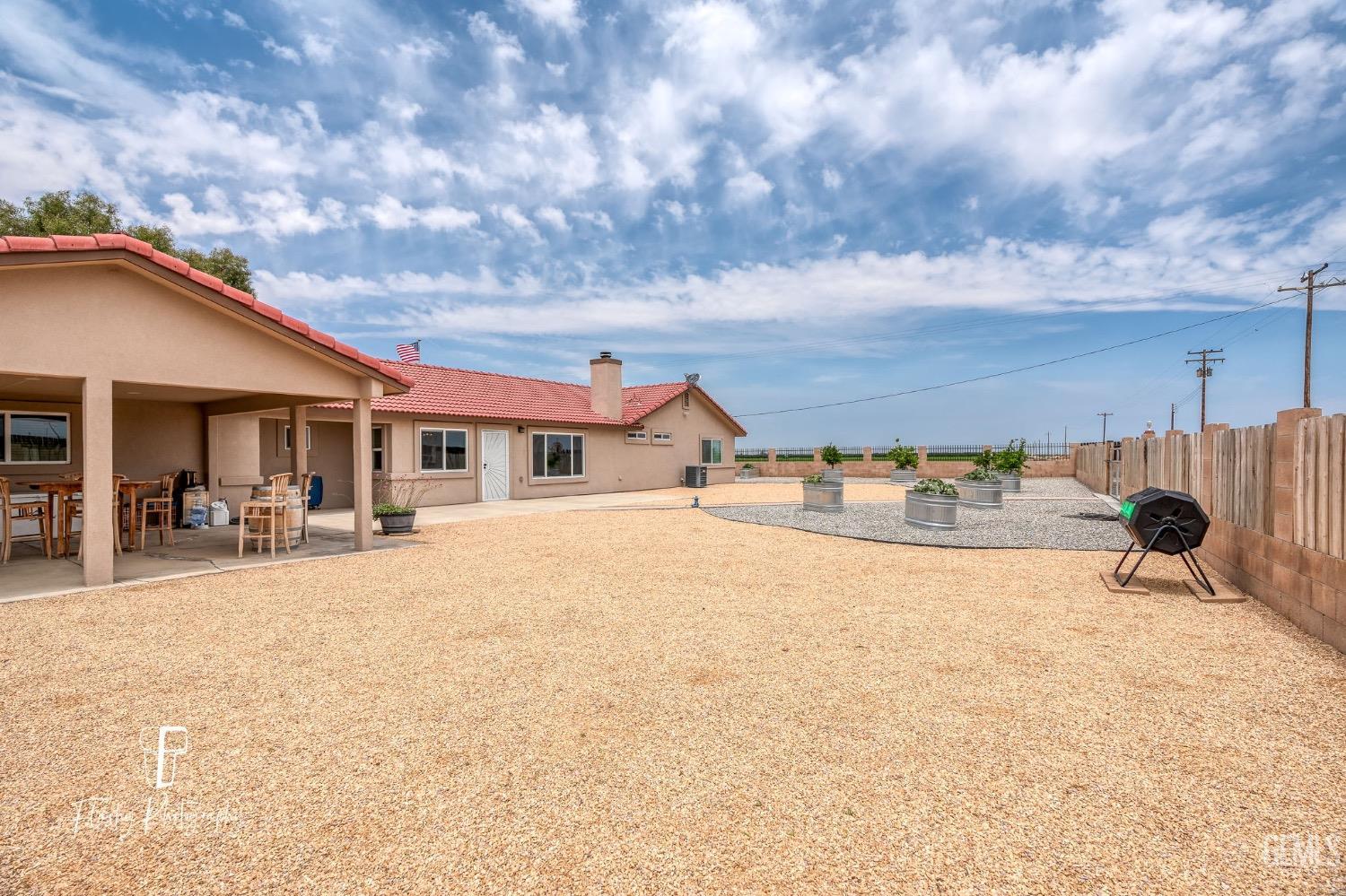 Undisclosed Address Buttonwillow, CA 93206 - Photo 38 of 65 a view of a house with backyard and sitting area