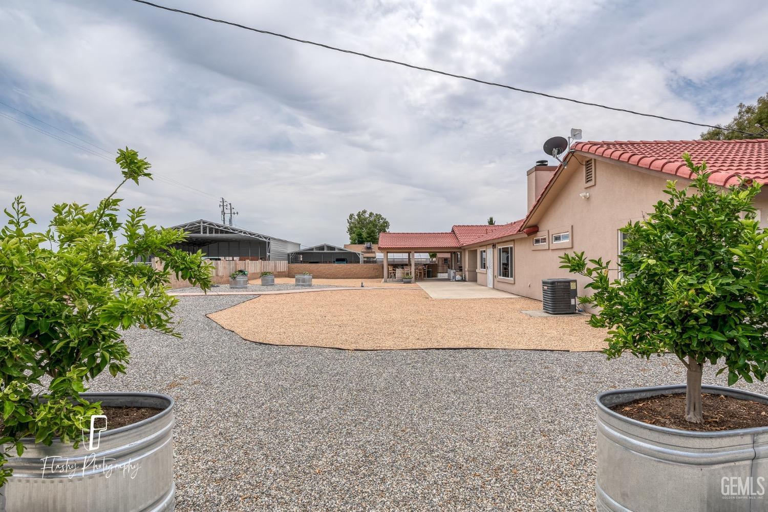 Undisclosed Address Buttonwillow, CA 93206 - Photo 45 of 65 a vase with flowers sitting on a table