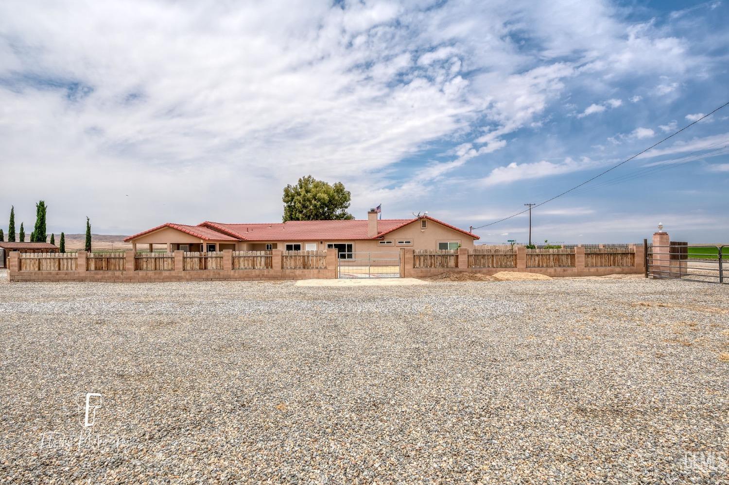 Undisclosed Address Buttonwillow, CA 93206 - Photo 54 of 65 a view of a big house with a big yard and large trees