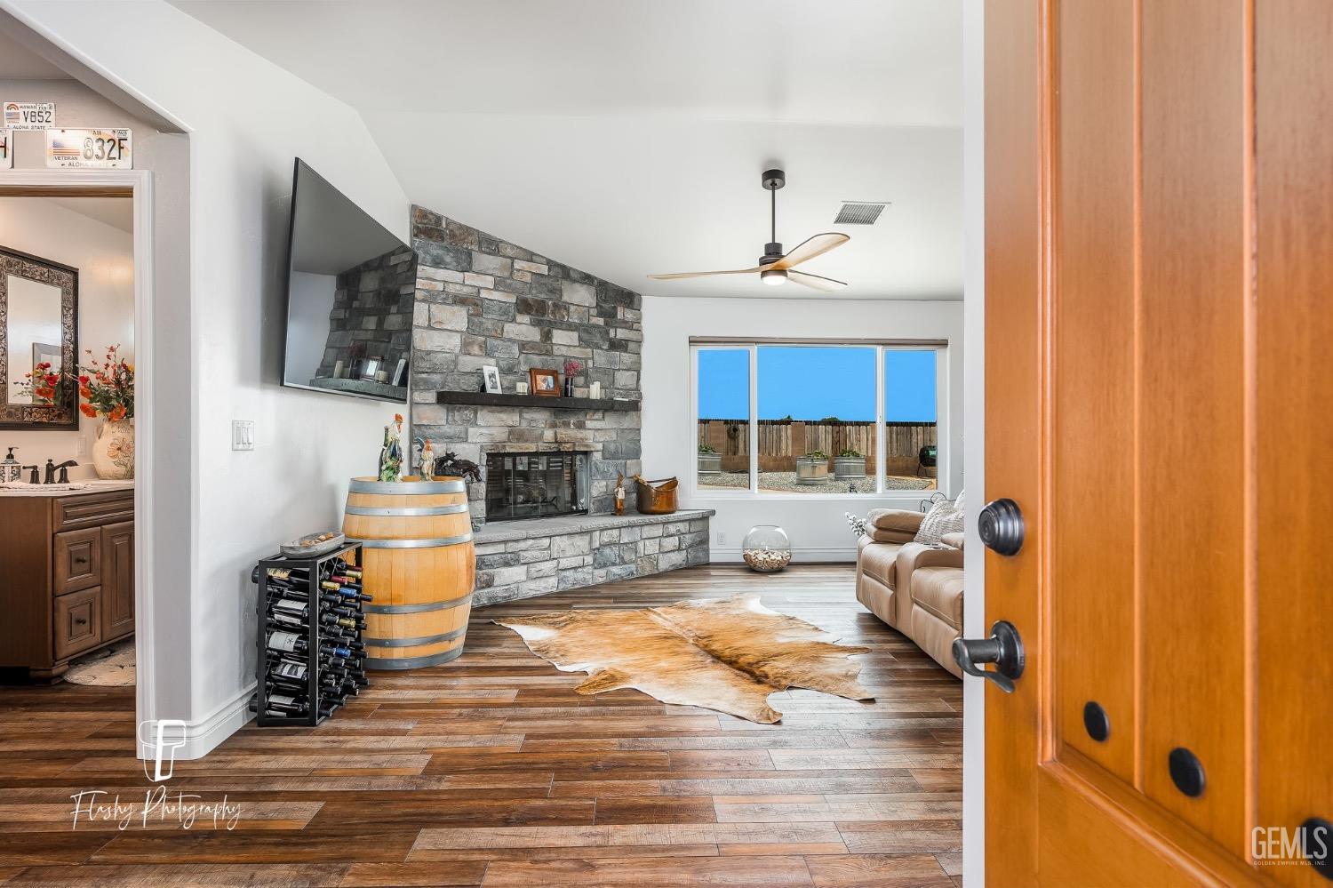 Undisclosed Address Buttonwillow, CA 93206 - Photo 6 of 65 a living room with furniture and a wooden floor