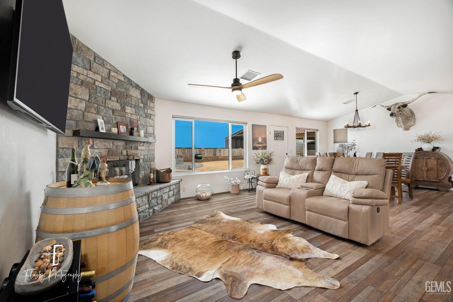 Undisclosed Address Buttonwillow, CA 93206 - Photo 7 of 65 a living room with furniture and a chandelier