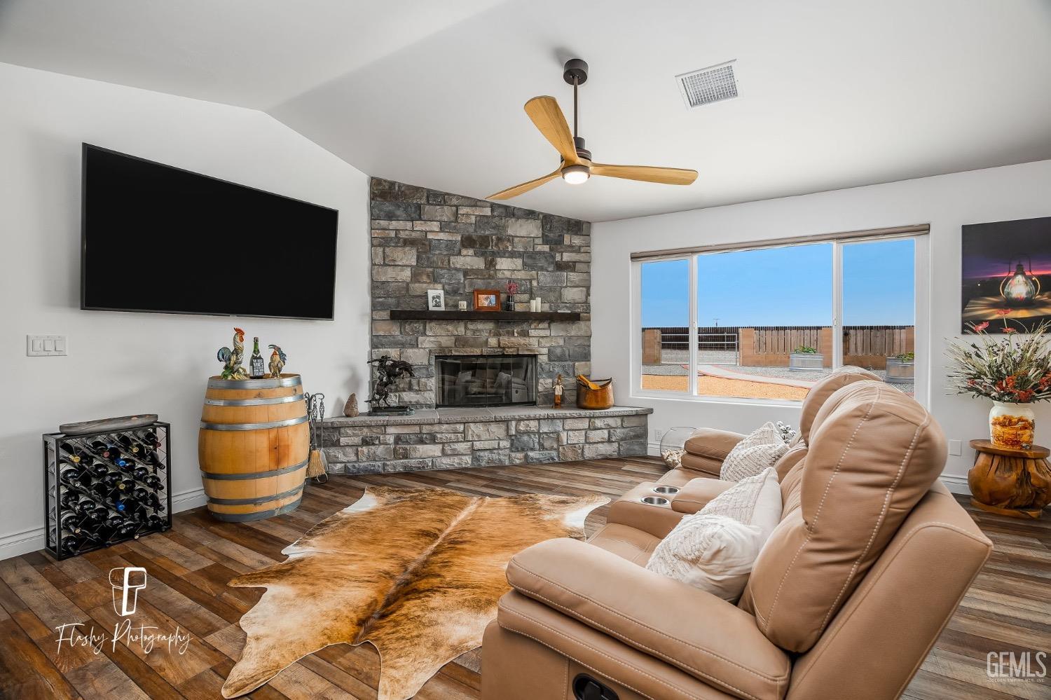 Undisclosed Address Buttonwillow, CA 93206 - Photo 8 of 65 a living room with furniture and a flat screen tv