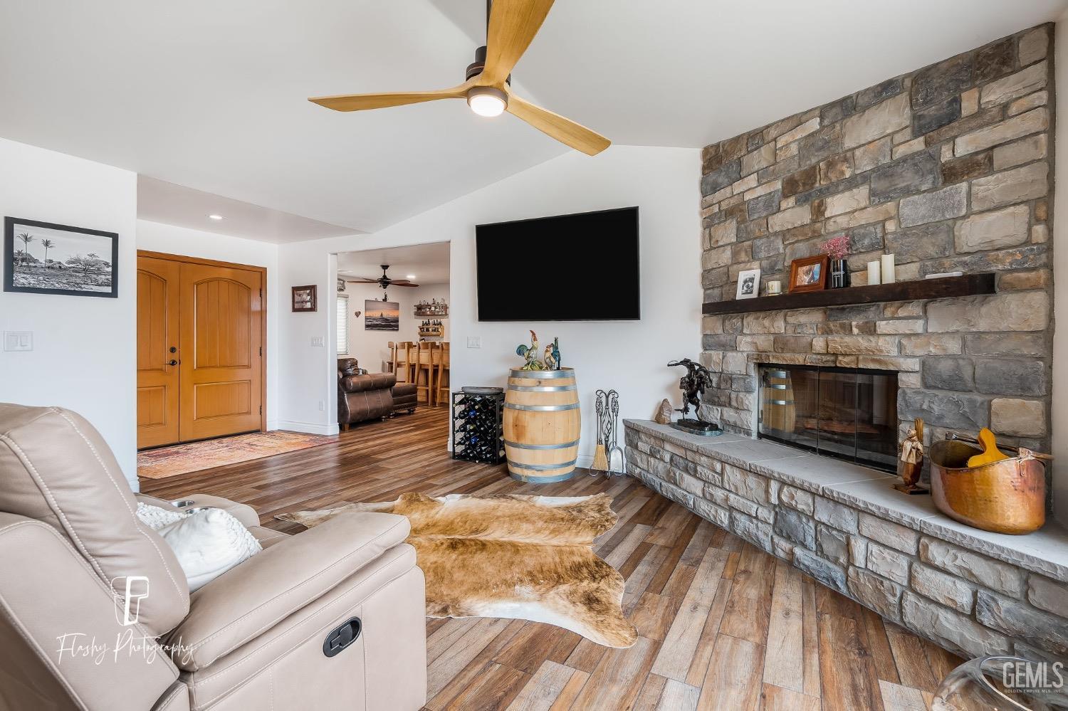 Undisclosed Address Buttonwillow, CA 93206 - Photo 9 of 65 a living room with furniture and a flat screen tv