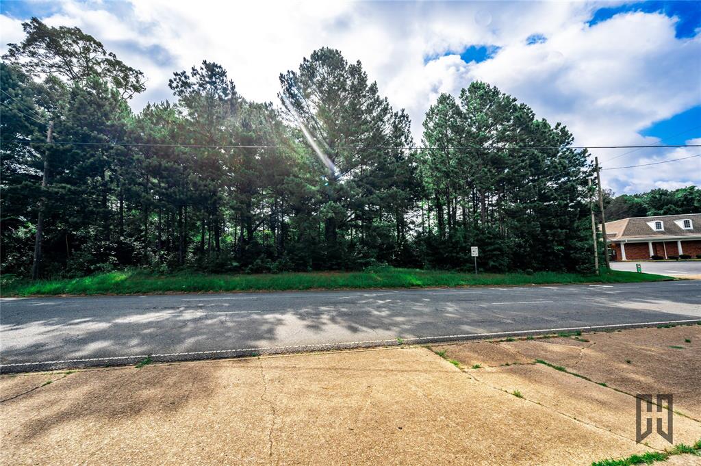 1312 Sibley Road Minden, LA 71055 - Photo 7 of 19 a view of a yard with a trees