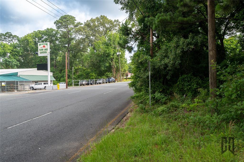1312 Sibley Road Minden, LA 71055 - Photo 9 of 19 a view of a street with a building and a street sign