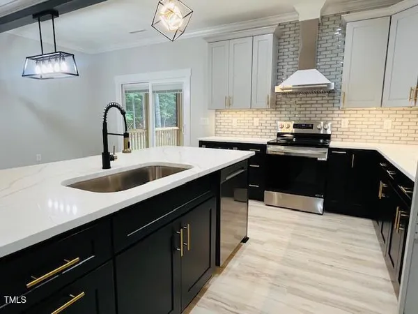 a kitchen with a sink and a stove